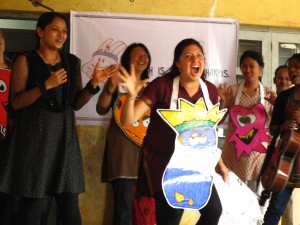 Lisa playing the "germ king" in a production of Hath Mein Sehat's health and hygiene education program at a primary school performance in Hubli, Karnataka.